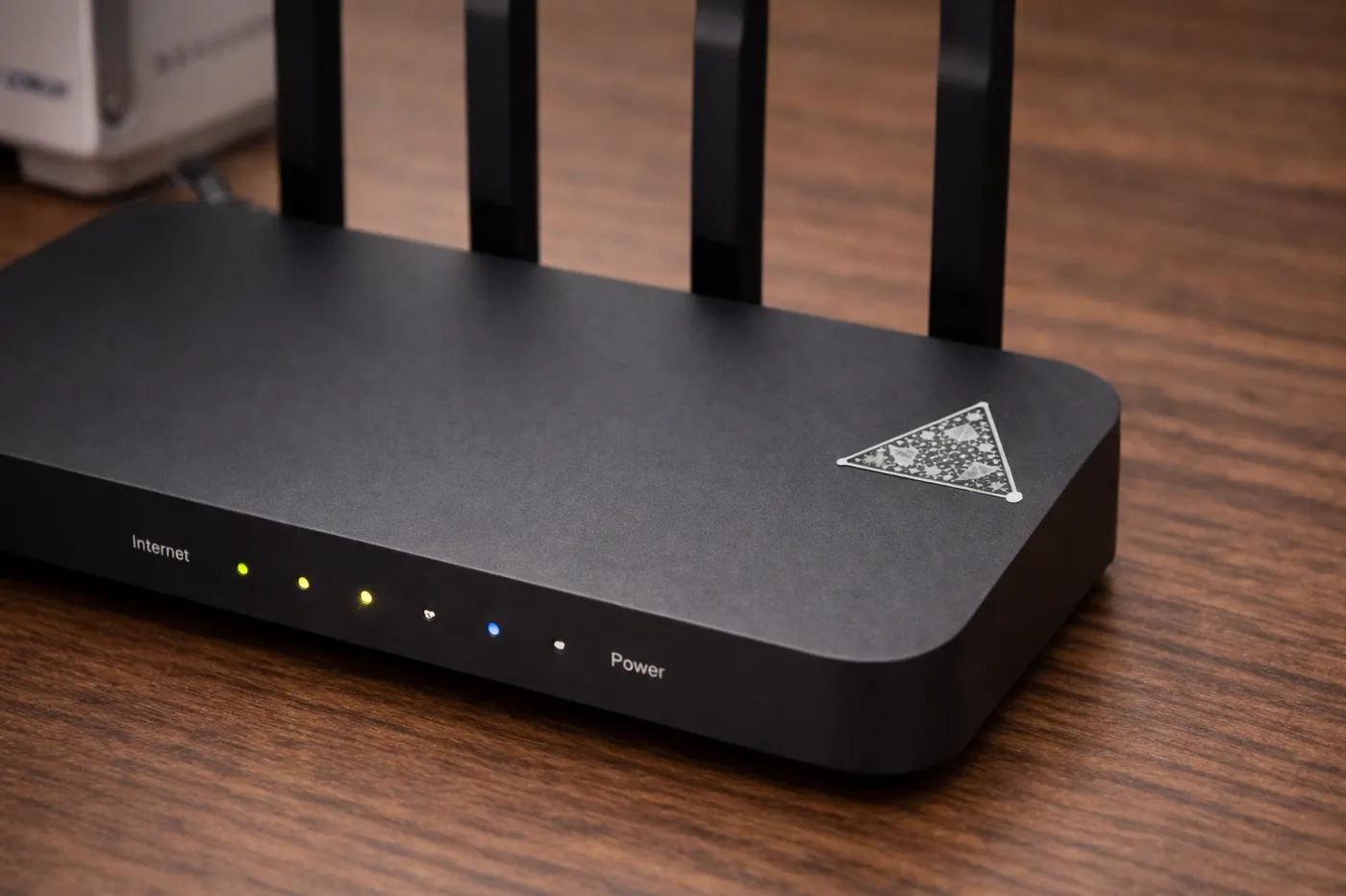 Black and white FractalGuard module placed on a router